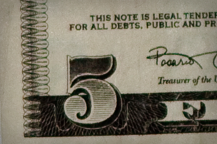 left lower corner of a 5 dollar bill